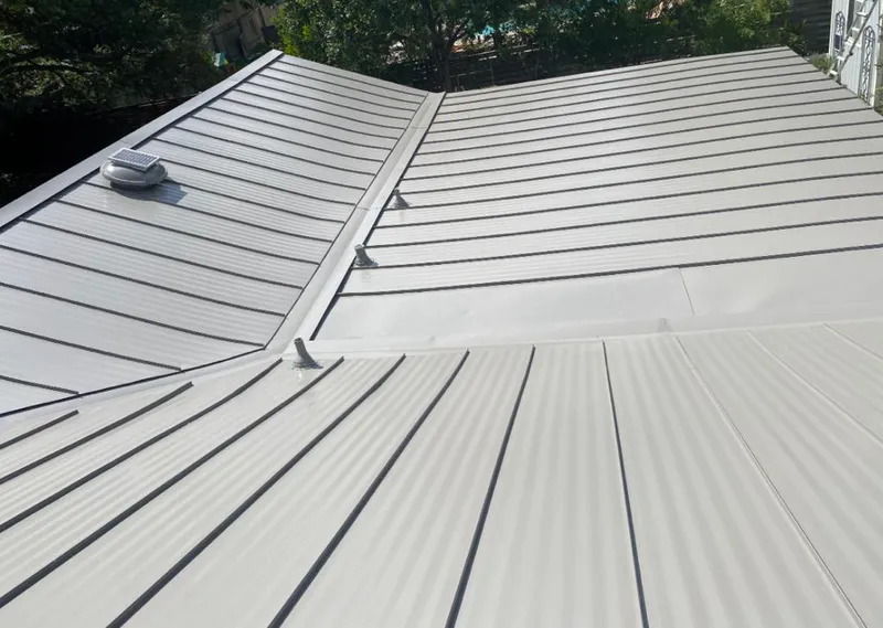Solar attic fan installed on a metal roof for Roof Ventilation in Midway